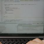 close up of a hand on a laptop keyboard